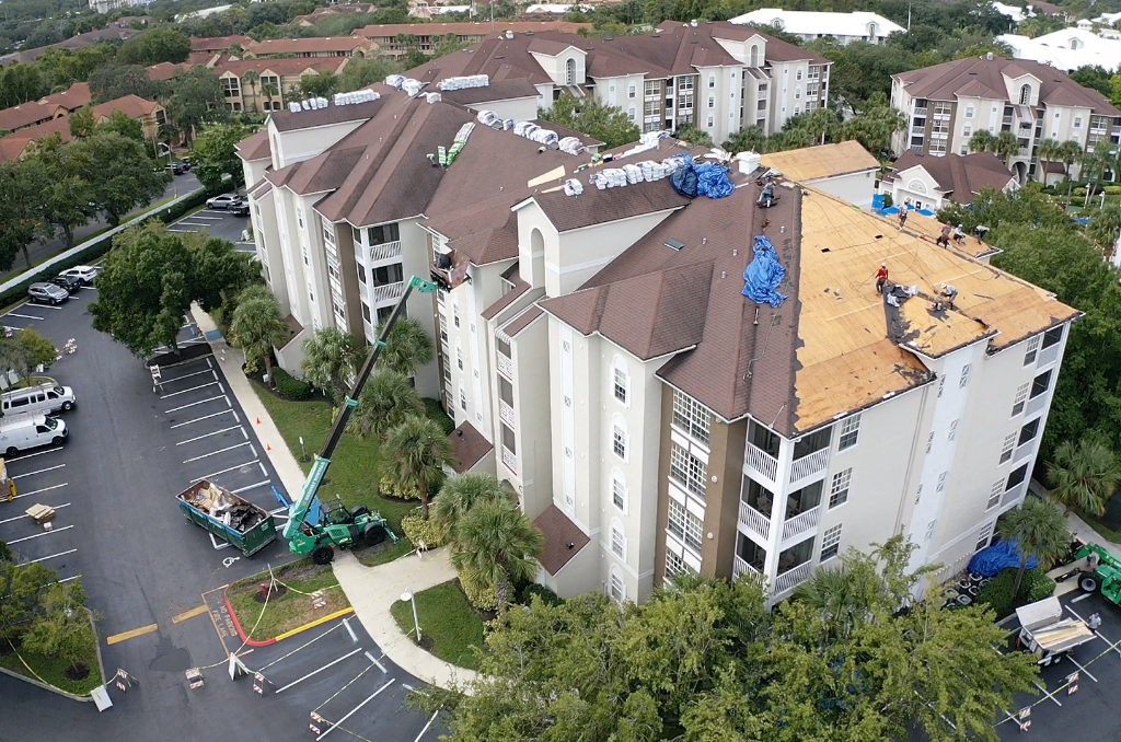 Multi-story condominium building roof replacement in progress in Ocala, FL - CBC Construction Group