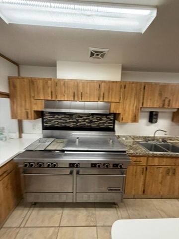 Kitchen remodel with commercial range and custom wood cabinets in Ocala, FL - CBC Construction Group